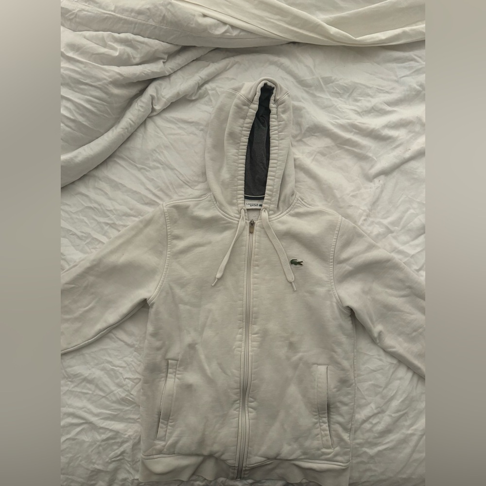 Lacoste size small women’s hoodie. Discoloration on the wrists,